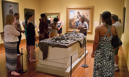 A docent guides a tour of the museum