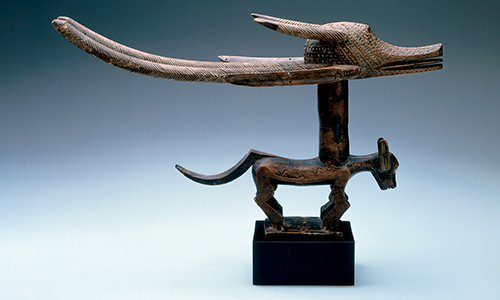 wooden statue of an antelope