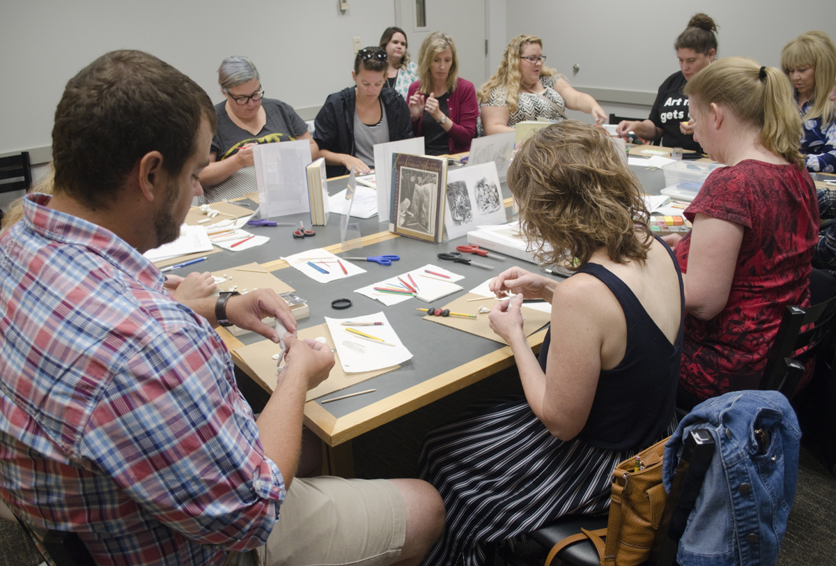 Teacheres participate in art activities at the museum