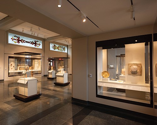 The Ancient Middle East gallery, with cases and a large glass window illustration