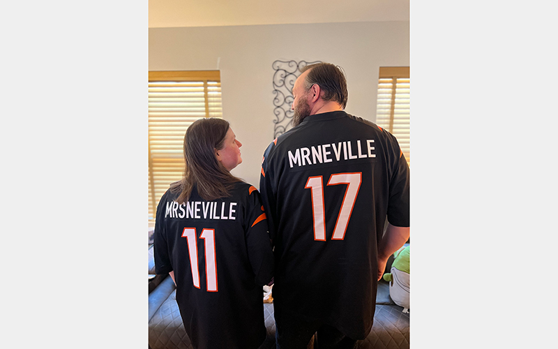 James and Alicia stand with their personalized Bengals jerseys