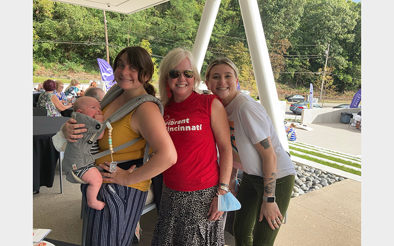 A group of white women smile for the camera