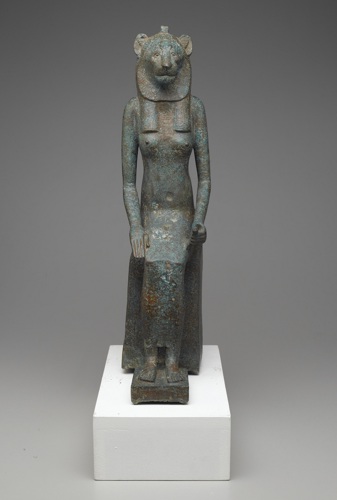 bronze statue of a human figure with a feline head