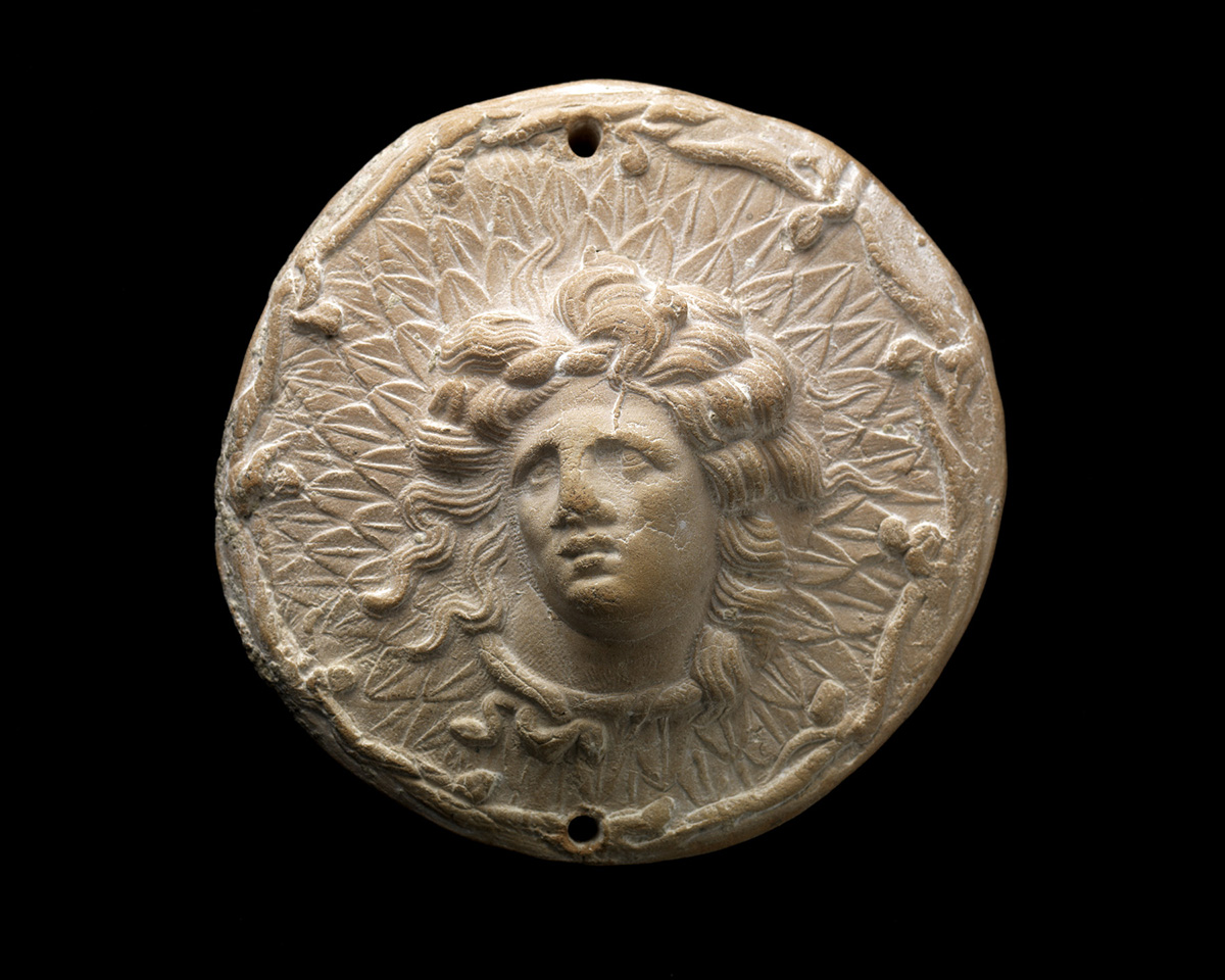 Face inside circle with flowing hair