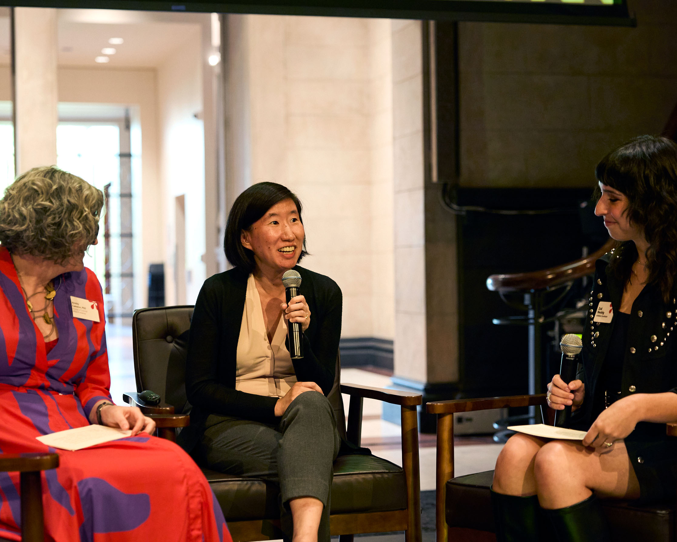 Three women speak at the museum