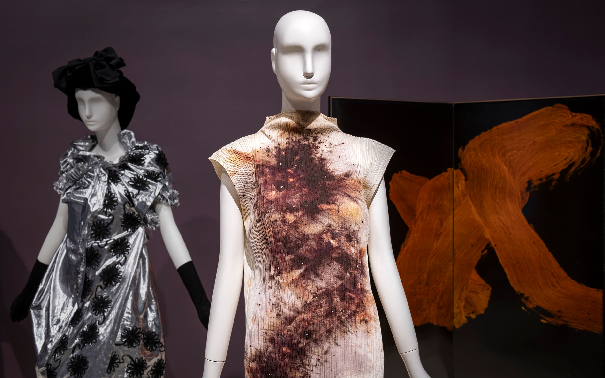 Two mannequins wearing fabulous dresses