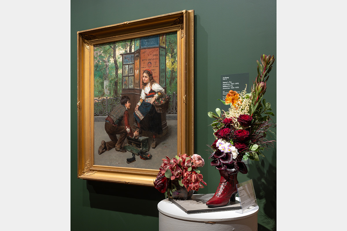 A floral arrangement in a red boot
