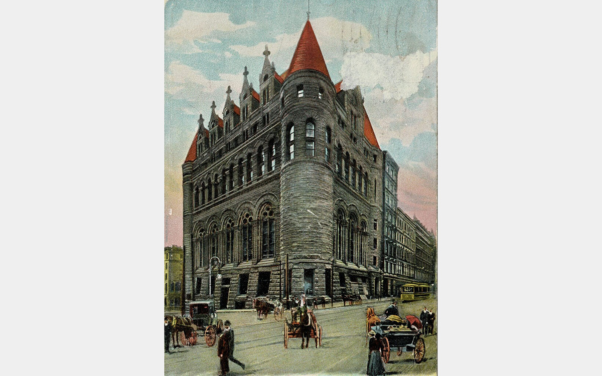 Color postcard rendering of a castle-like stone building in an urban setting with horse carriages in an 1800s street scene