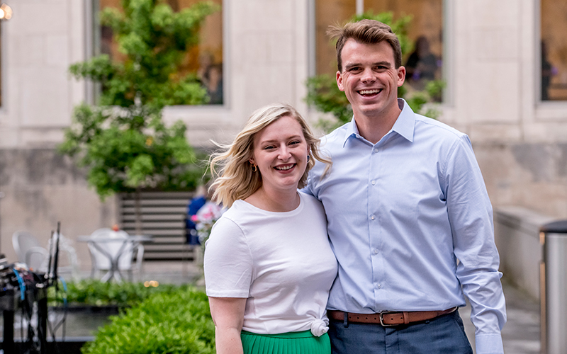 A couple poses in the Alice Bimel Courtyard