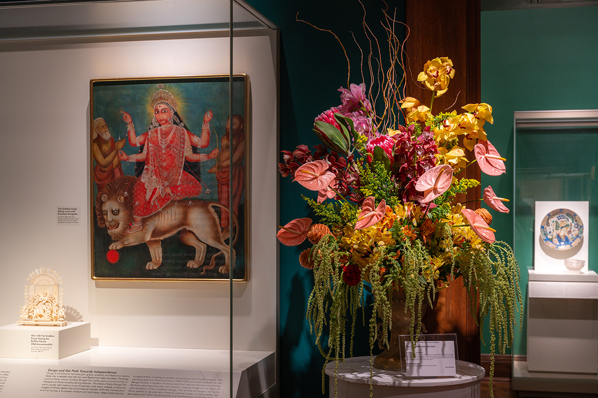 A big, colorful floral arrangement with dangling green details