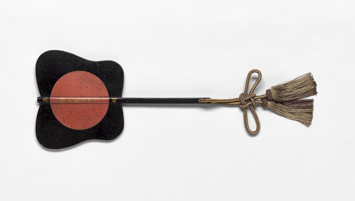 A black fan with butterfly-shaped, rounded edges.