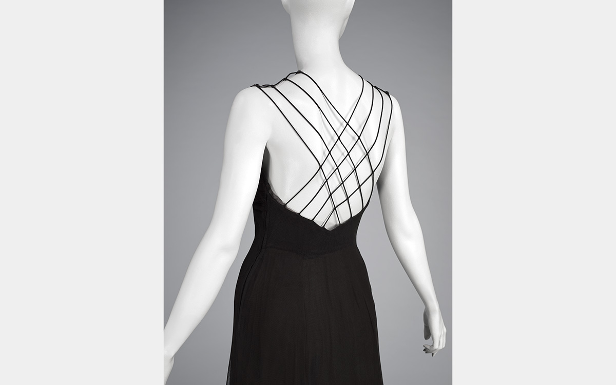 A black dress with open, spaghetti strap back