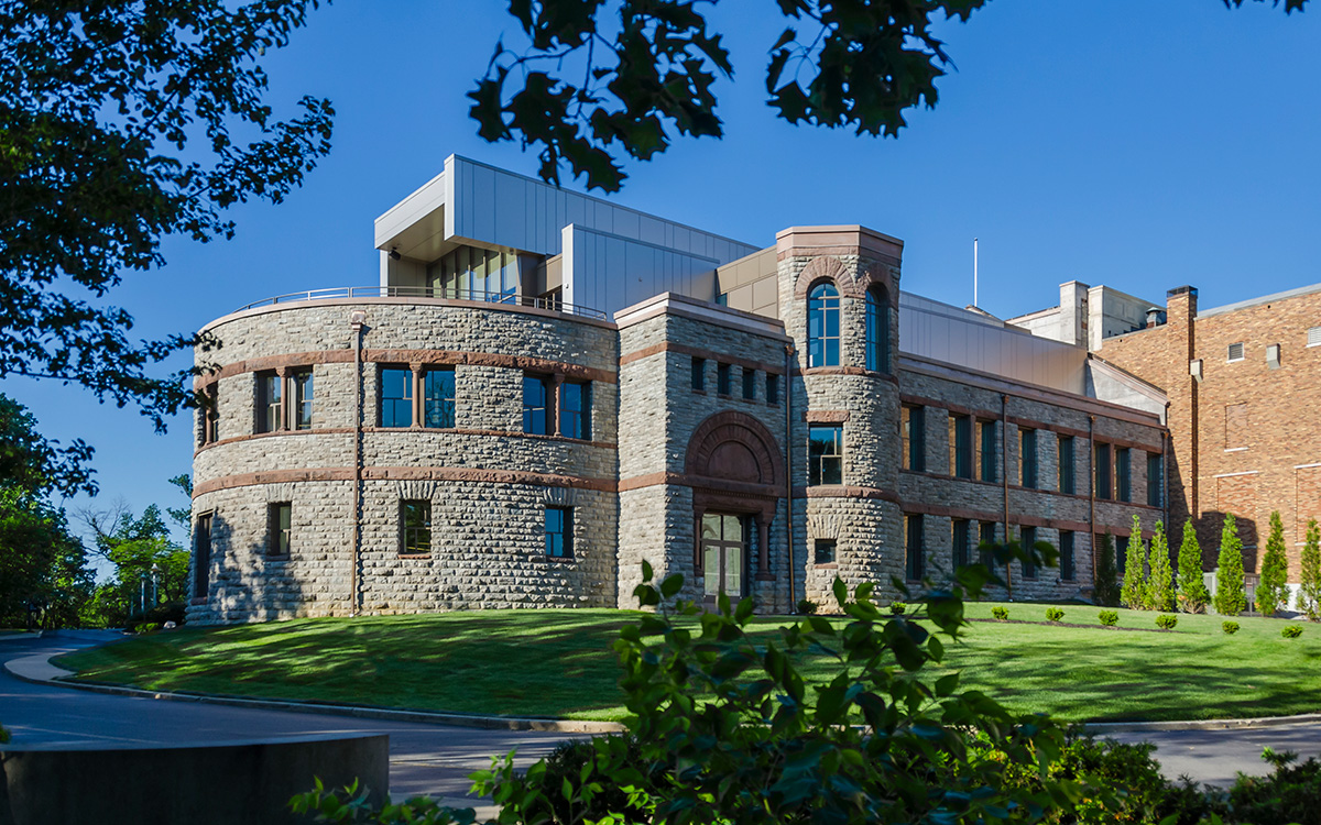 Stone building with modern rooftop addition