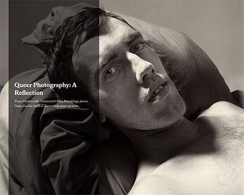 A shirtless white man lays on pillows, featuring the text "Queer Photography: A Reflection"