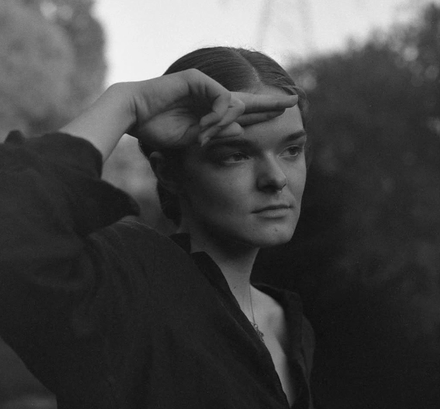 Black and white photo of a person saluting