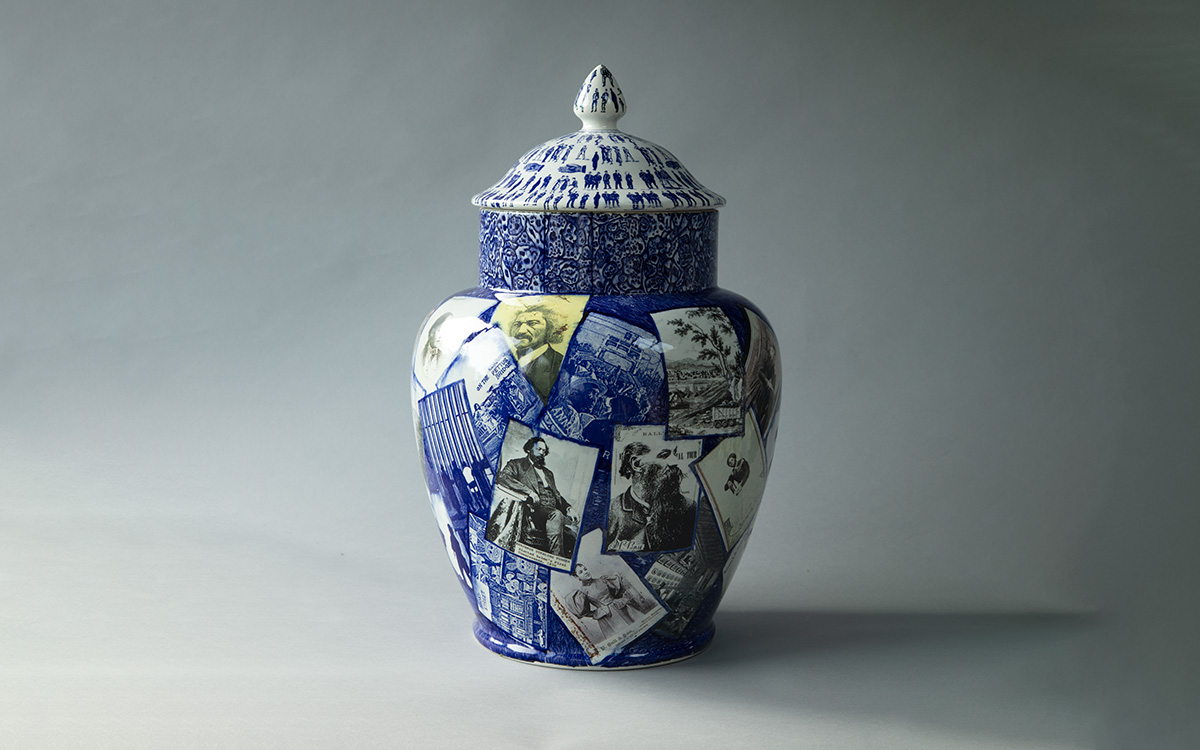A blue and white transferware jug with a collage of historical photos