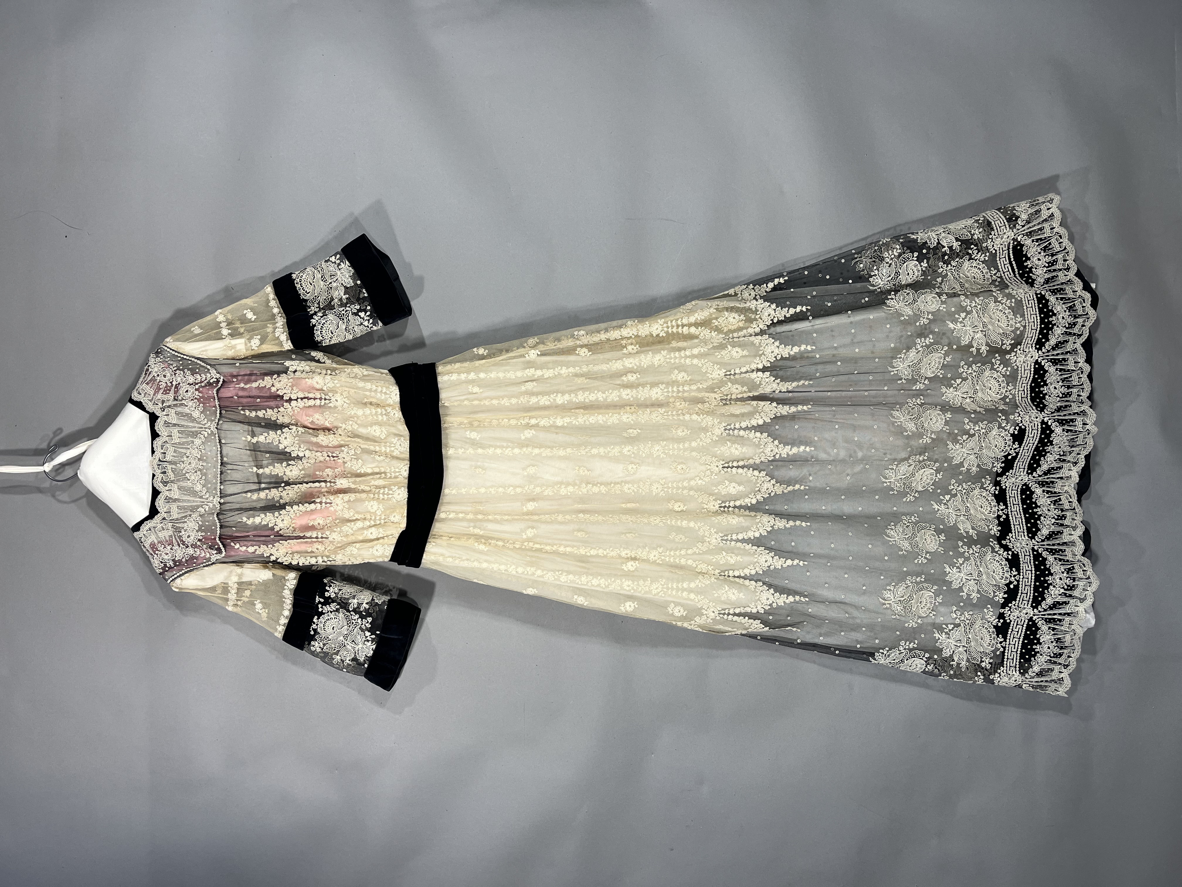 Front and back of lacey long dress with black sash