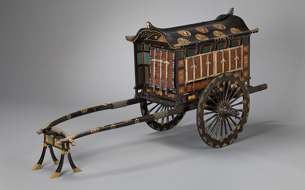 An ornate cart with fine lacquered floral decorations