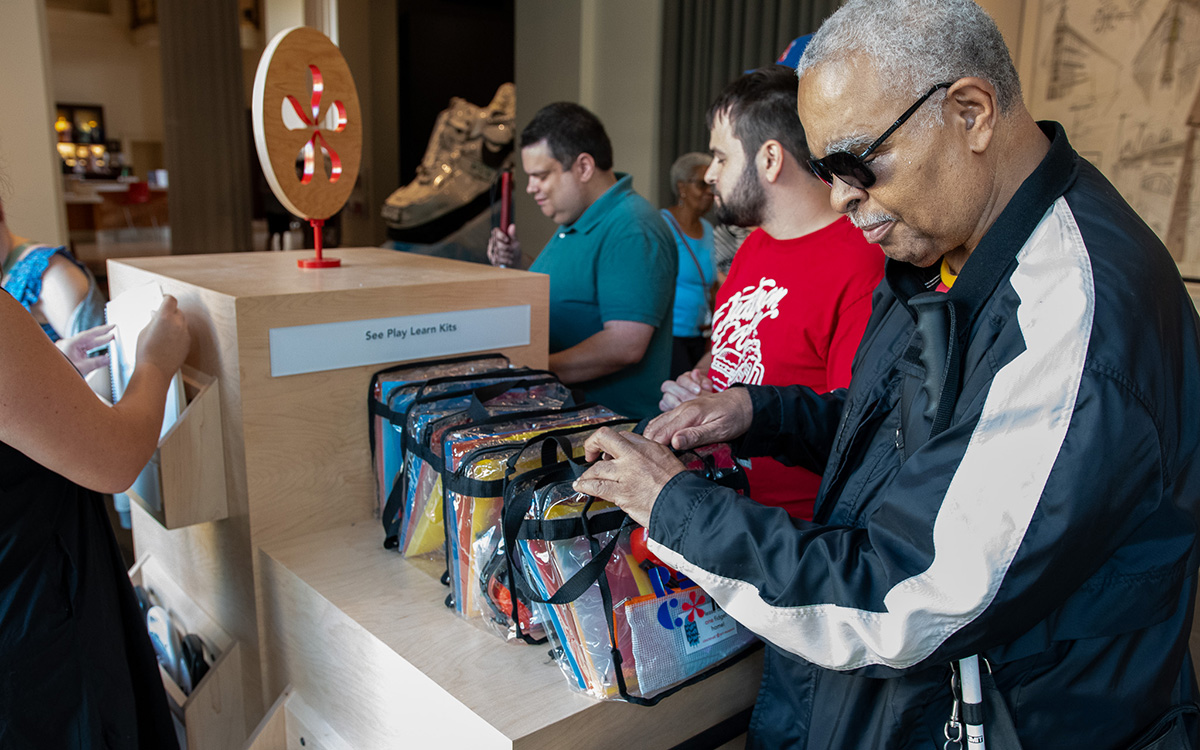 A Black man who is blind explores the Welcome Cart