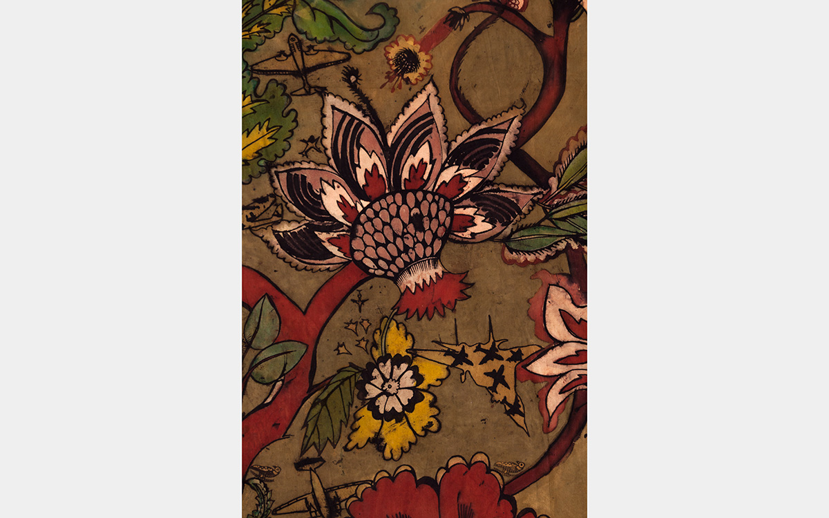 Fantastical floral imagery -- in shades of red, green, gold, black, and pink against tan background -- with images of fighter jets.