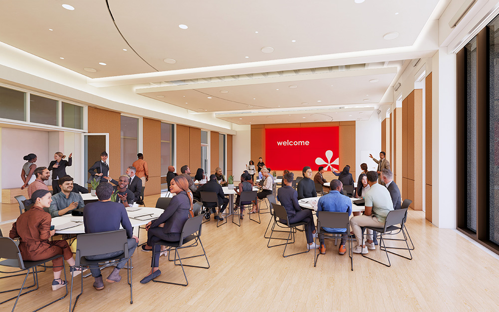 Inside the room, featuring round tables surrounded by people