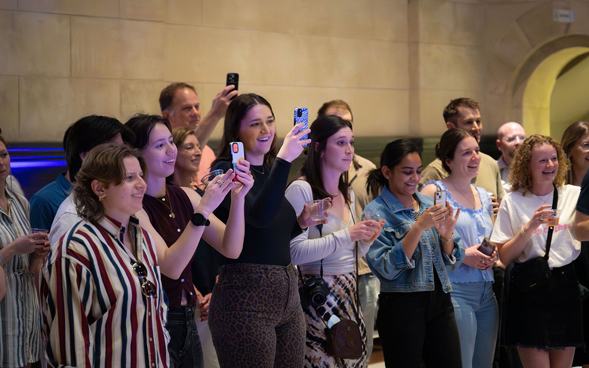The crowd films a performance