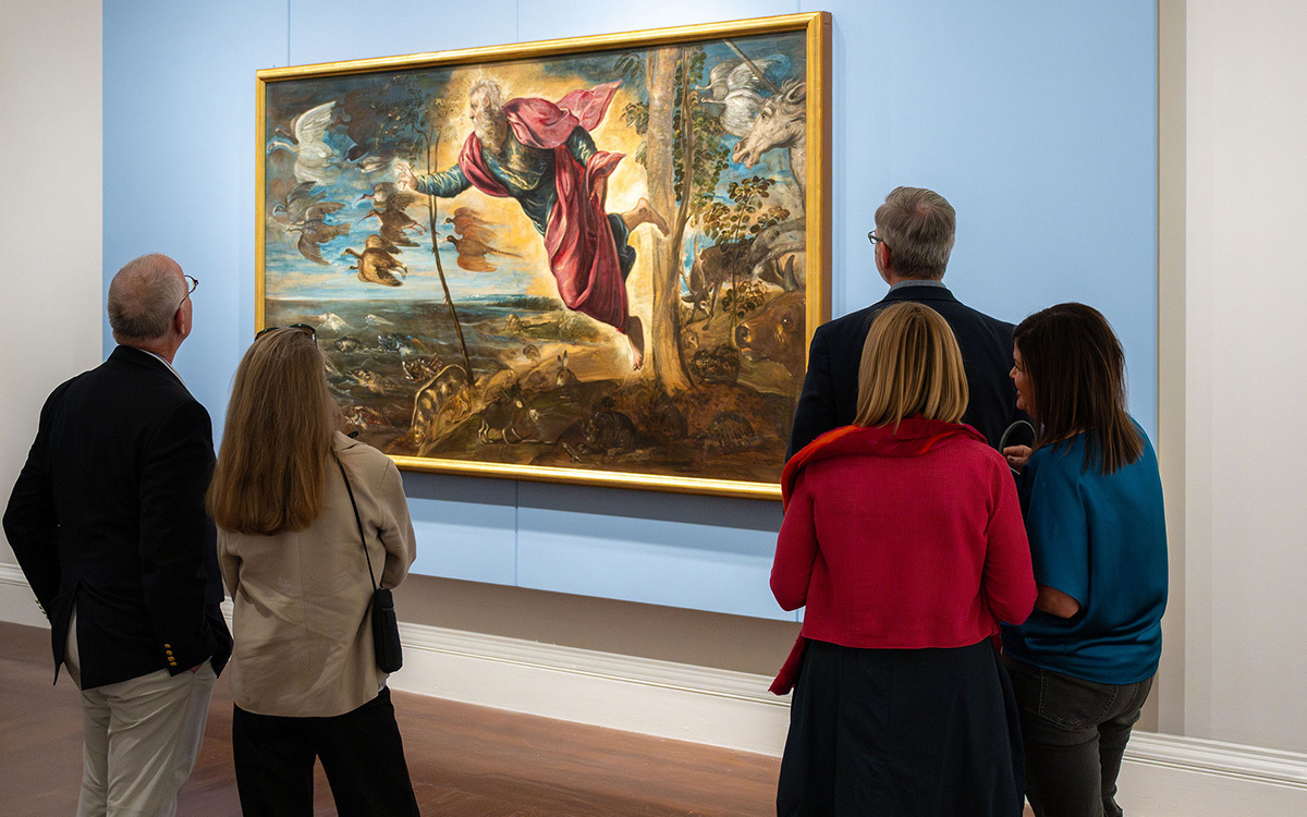 A group of white people look at a large painting of a glowing white perosn