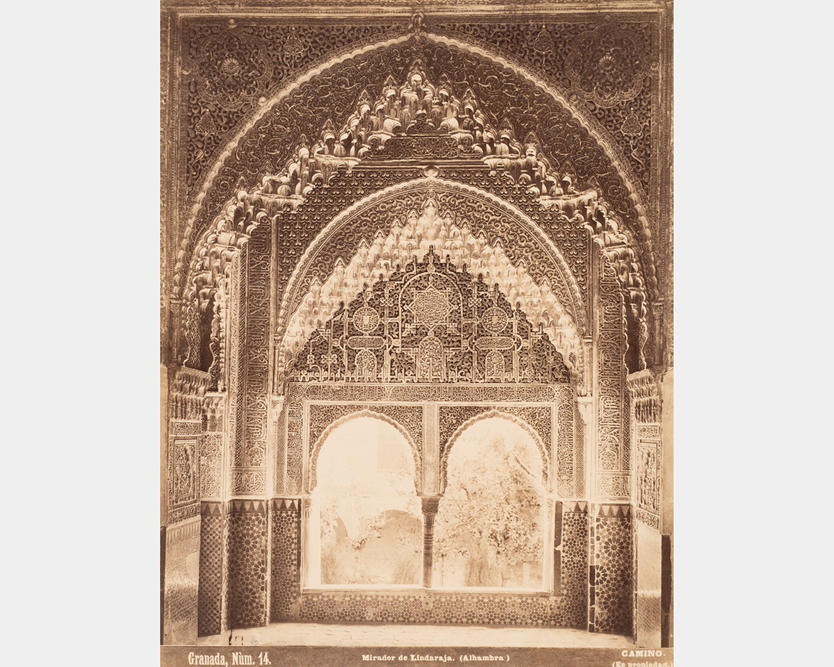 Rendered in sepia tones, a series of ornate arches frame a double-arched window opening separated by a single column.