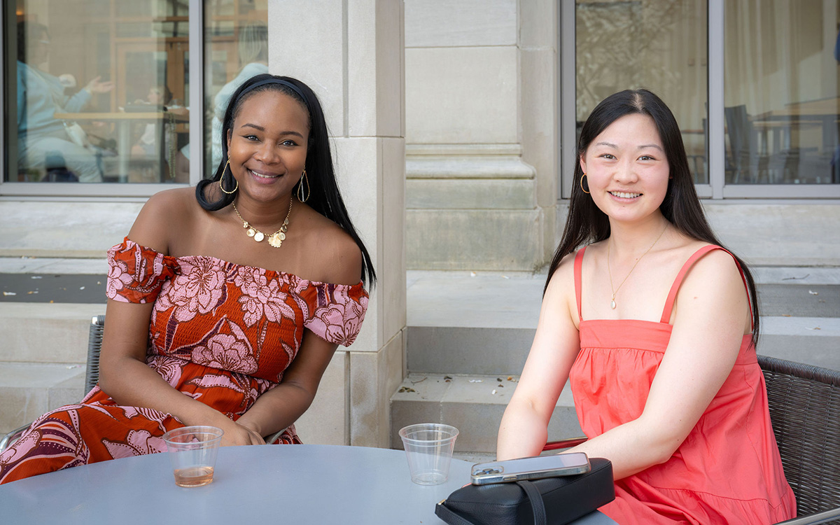 Two women smile at the camera