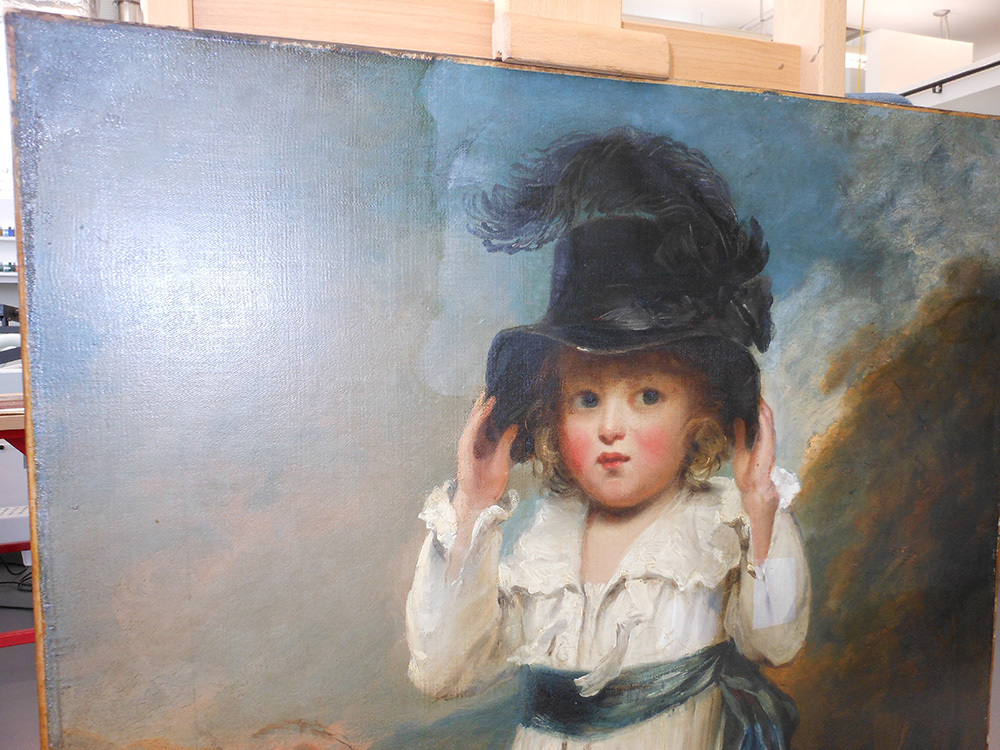 The same painting of the young white girl. The painting is much brighter