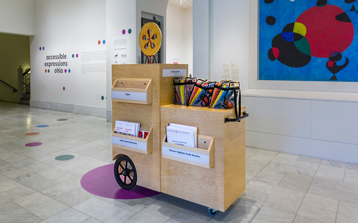 The side of the cart, with brochures, booklets, and kits