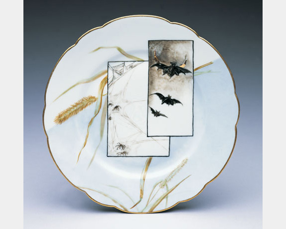 A ceramic plate with images of wheat sheaths and flying bats