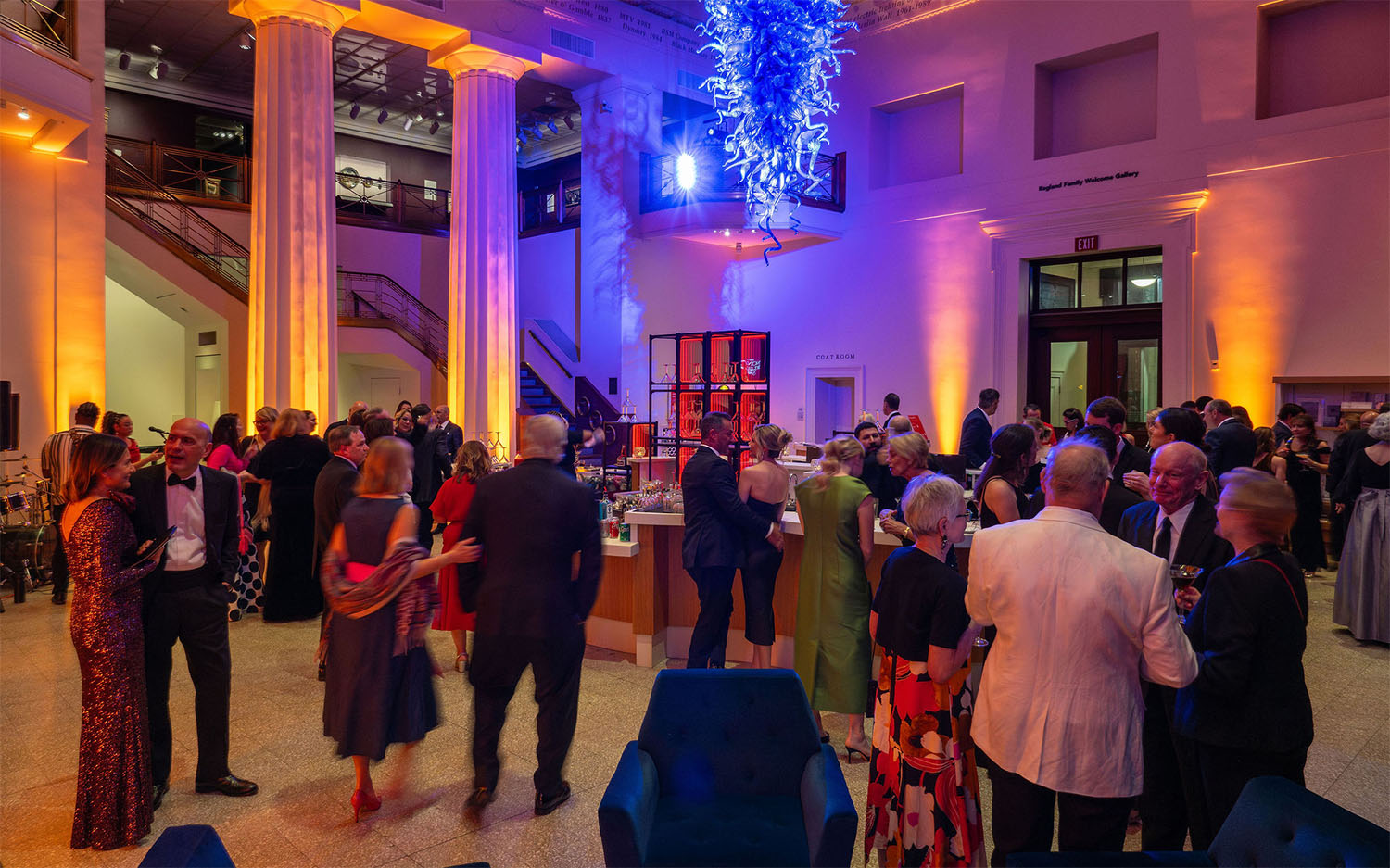 Partygoers mingle in the lobby