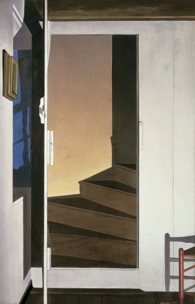 An open door reveals an interior staircase leading up to another floor.