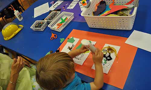 youth visitors working on arts and crafts