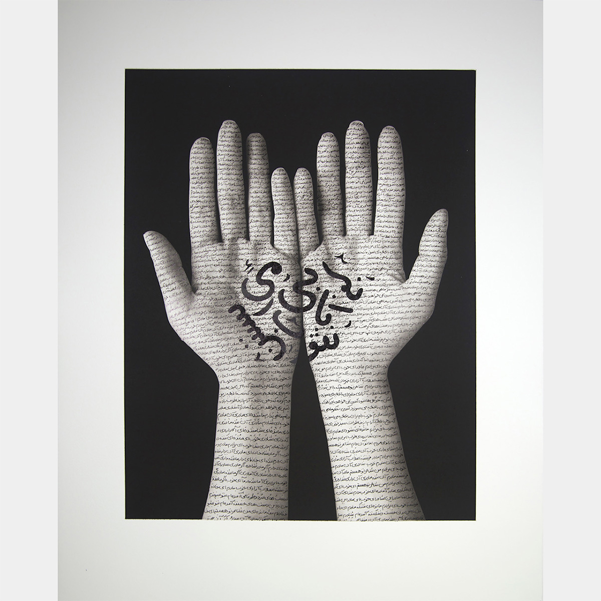 A photo of hands with Arabic writing on them