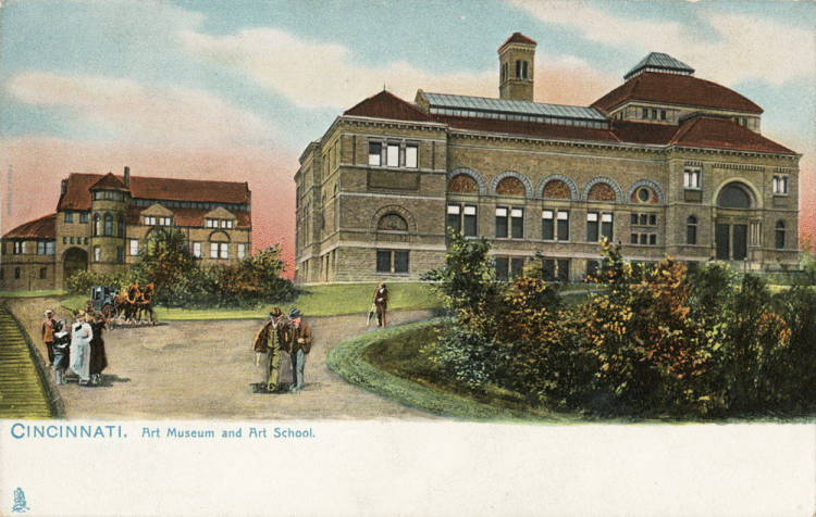 Two stone buildings, one small and one large, sit on a small hill while women in long skirts and men in suits walk in the foreground.