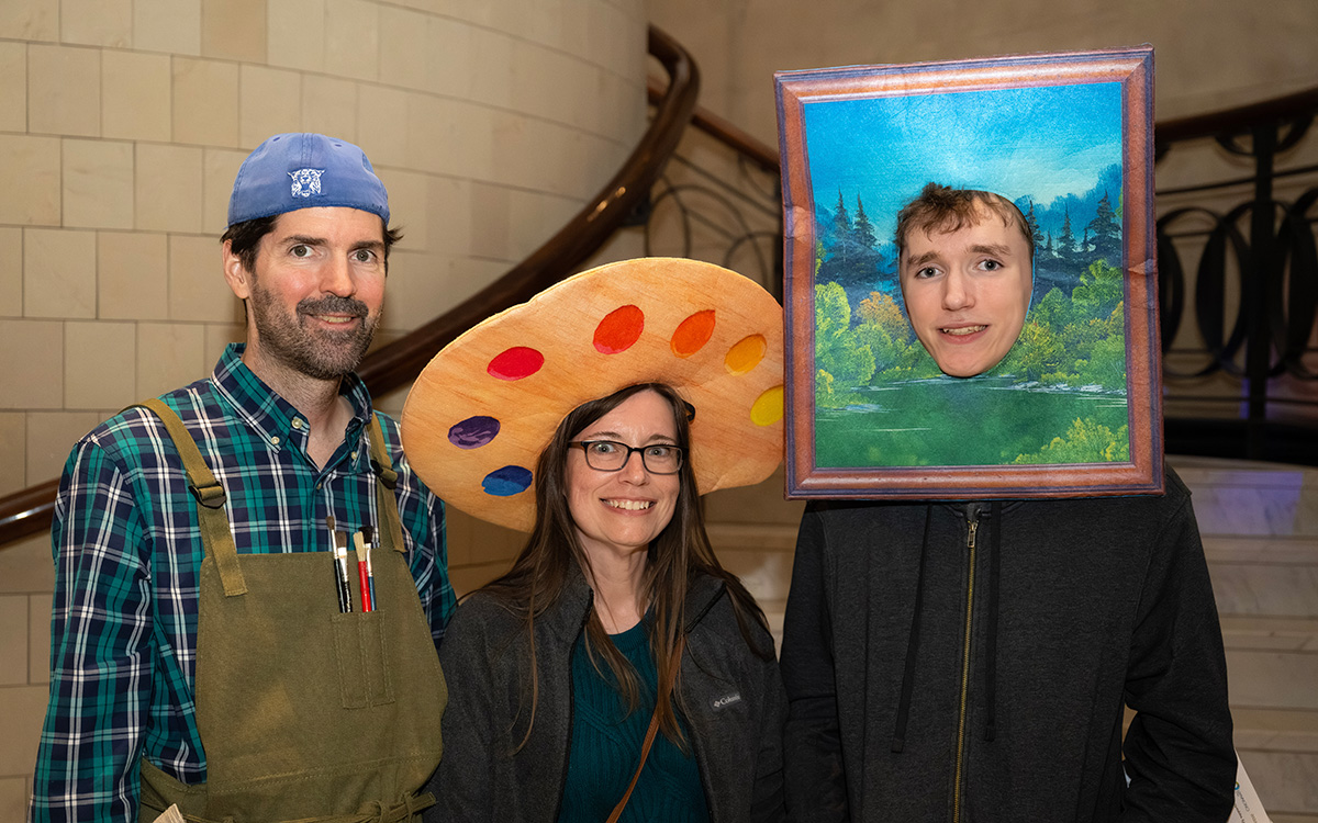 Visitors dressed as painters and a painting