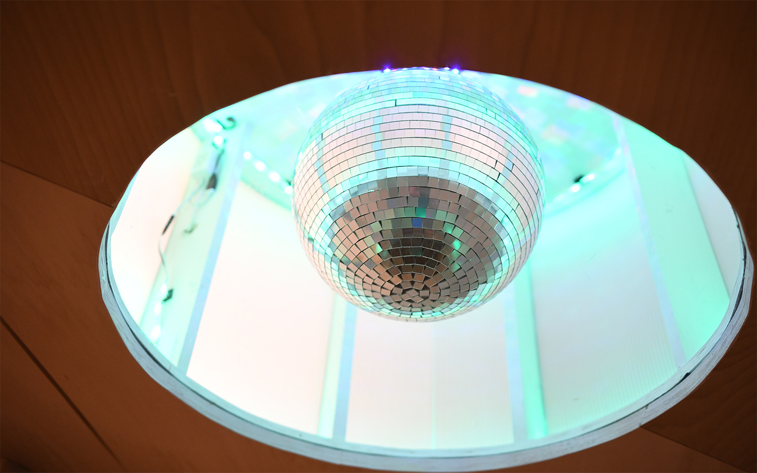A colorful disco ball in a large shade