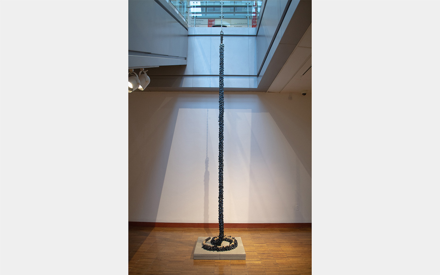 A long, chain-like object hangs from the ceiling