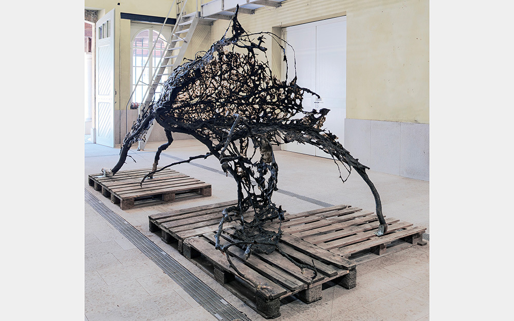 A fibrous sculpture that resembles a four-legged animal